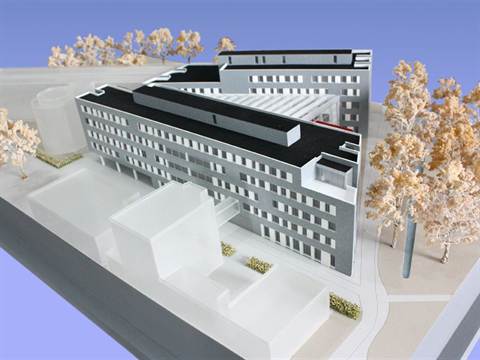 Maquette van een groot onderwijsgebouw met bomen